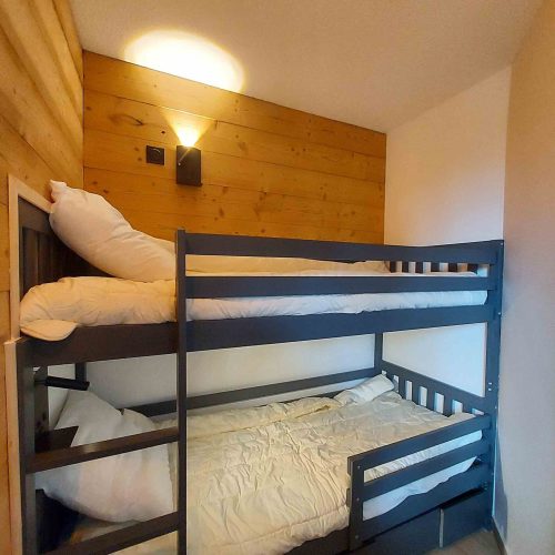 Lit superposé dans un logement en location saisonnière géré par la conciergerie Les Clefs en Main
